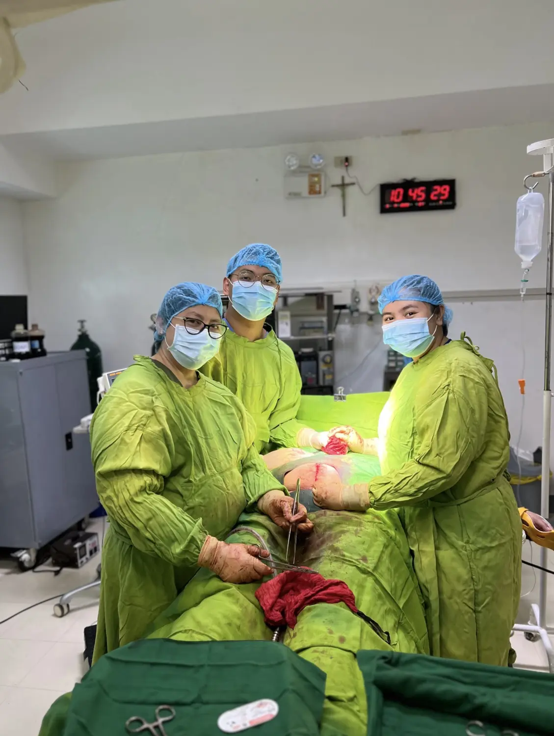 Janjae with a surgical team in an operating room