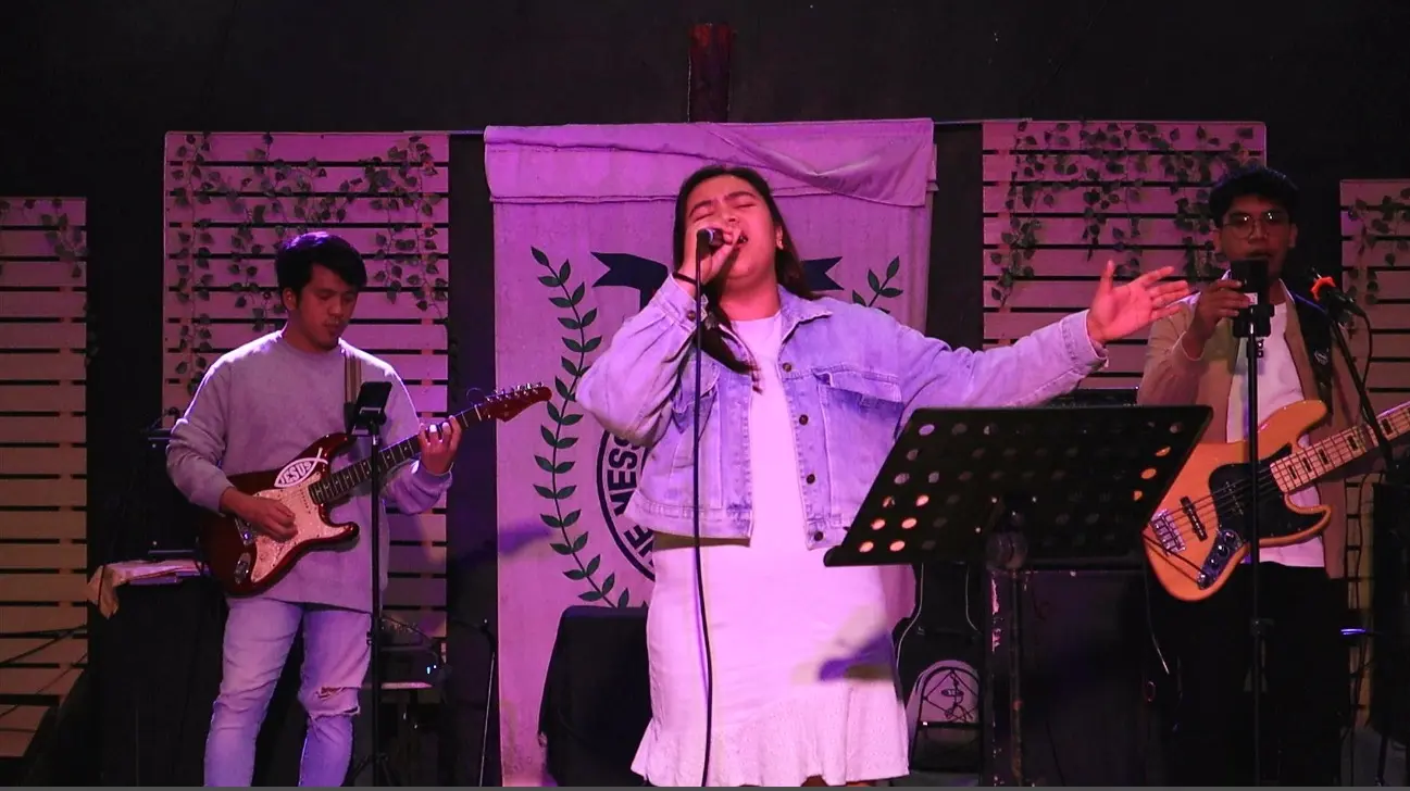 Janjae leading worship at church